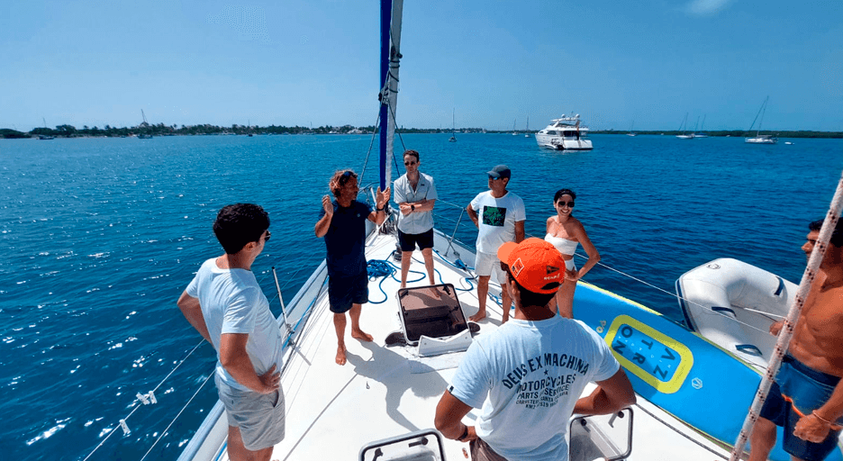 Students receiving sailing instruction on deck