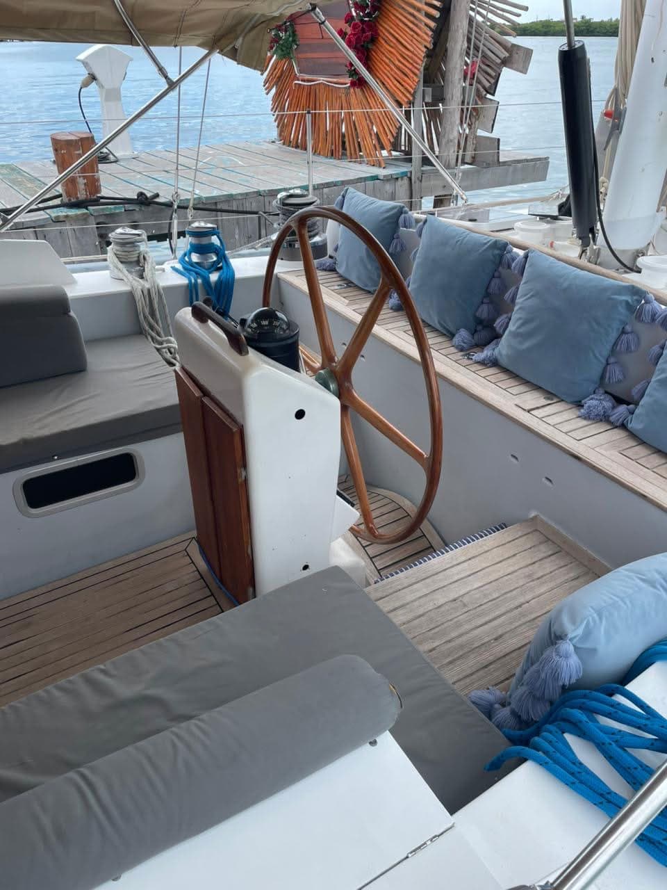 Flying Wing aft cockpit with wooden wheel and blue tassel cushions