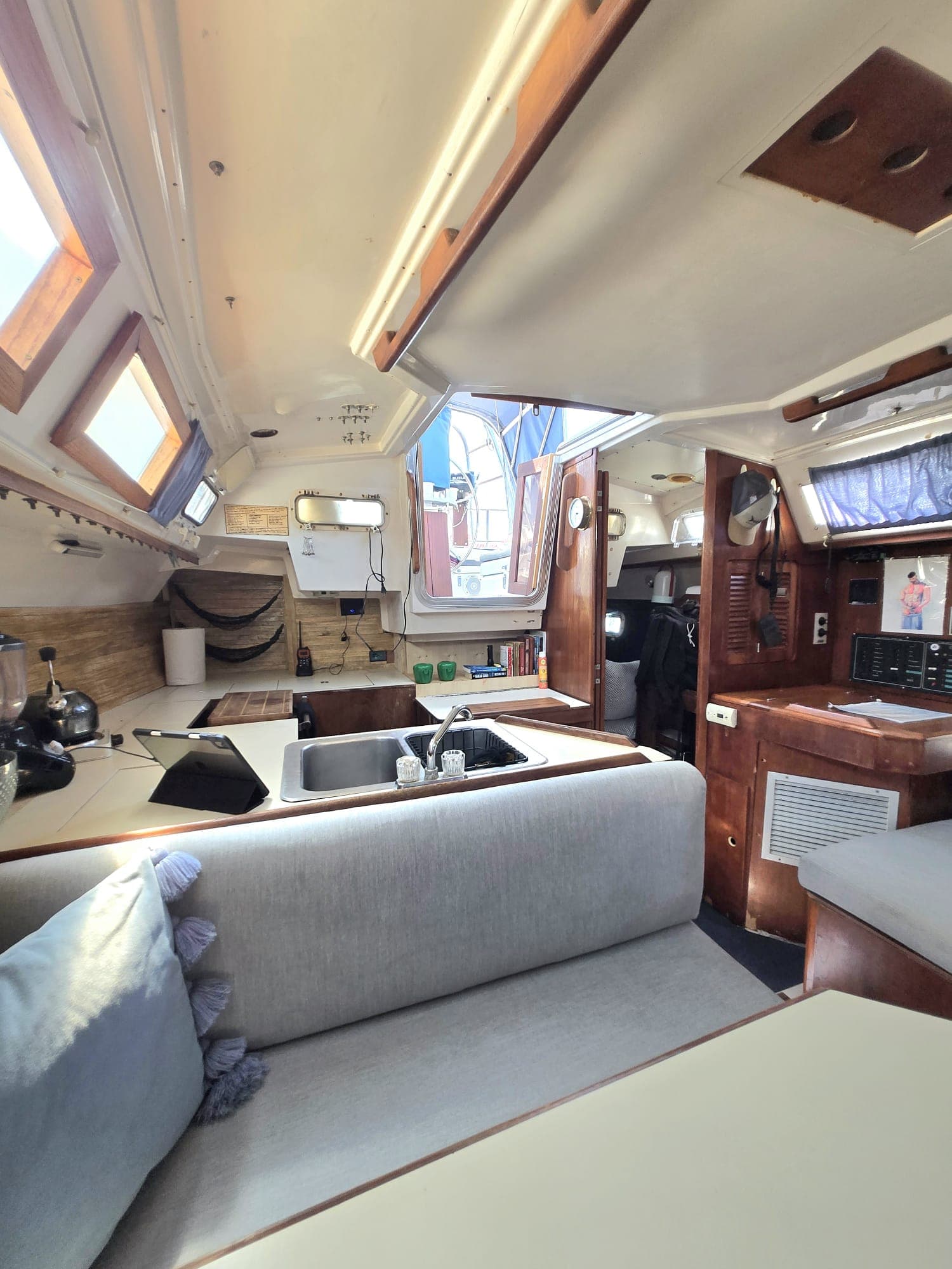 SISU salon with mahogany trim, hatch light and cushioned settee